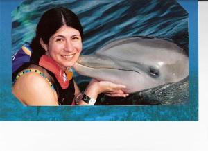 Melissa with a dolphin in Mexico